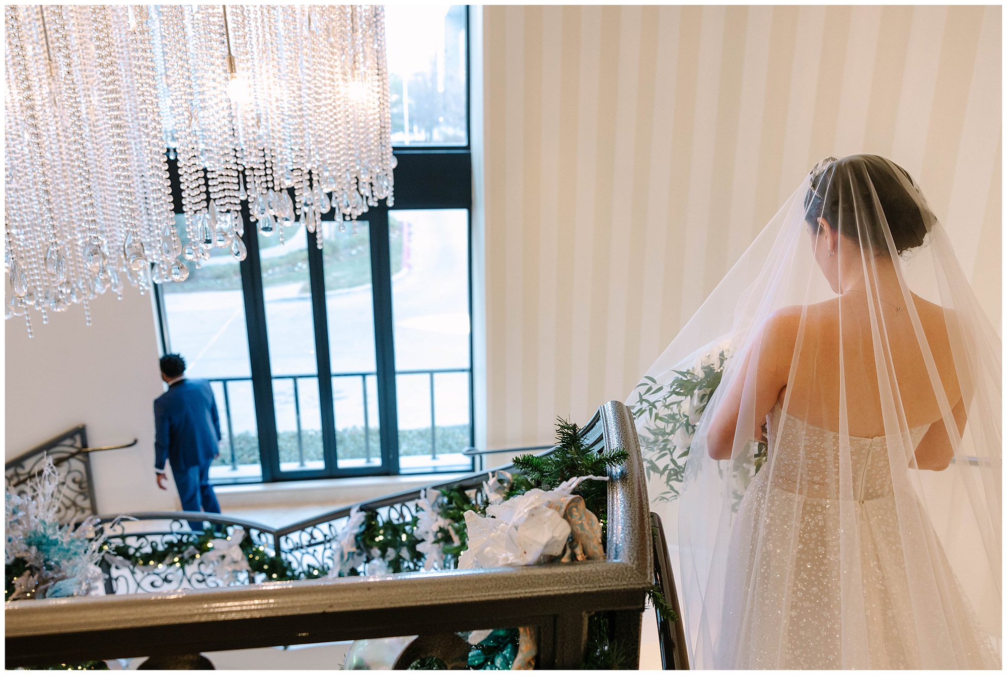 bride walking down iconic skirvin hotel staircase
